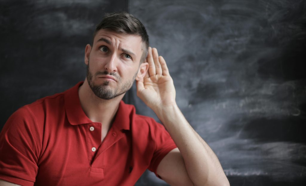 Person holding ear