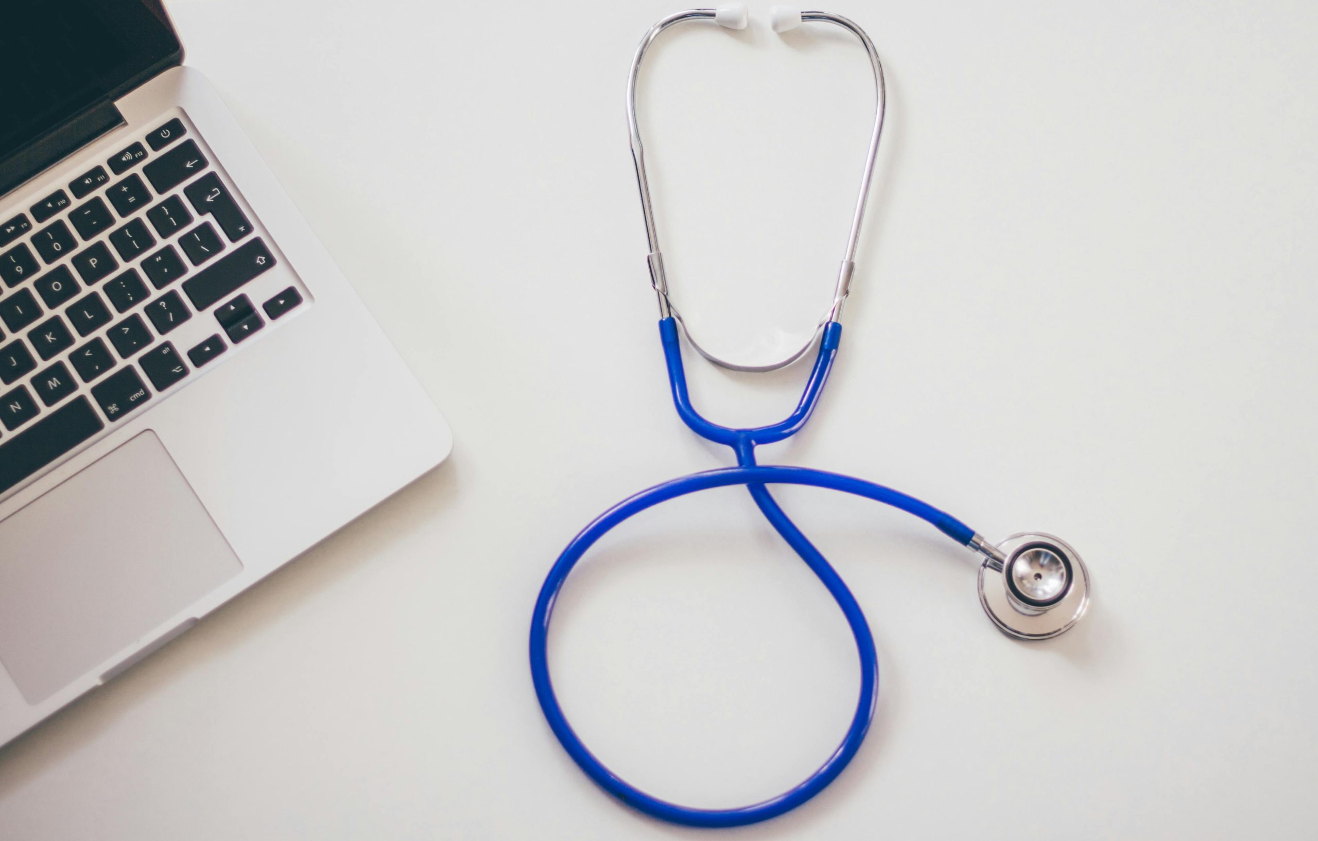 Stethoscope by a laptop