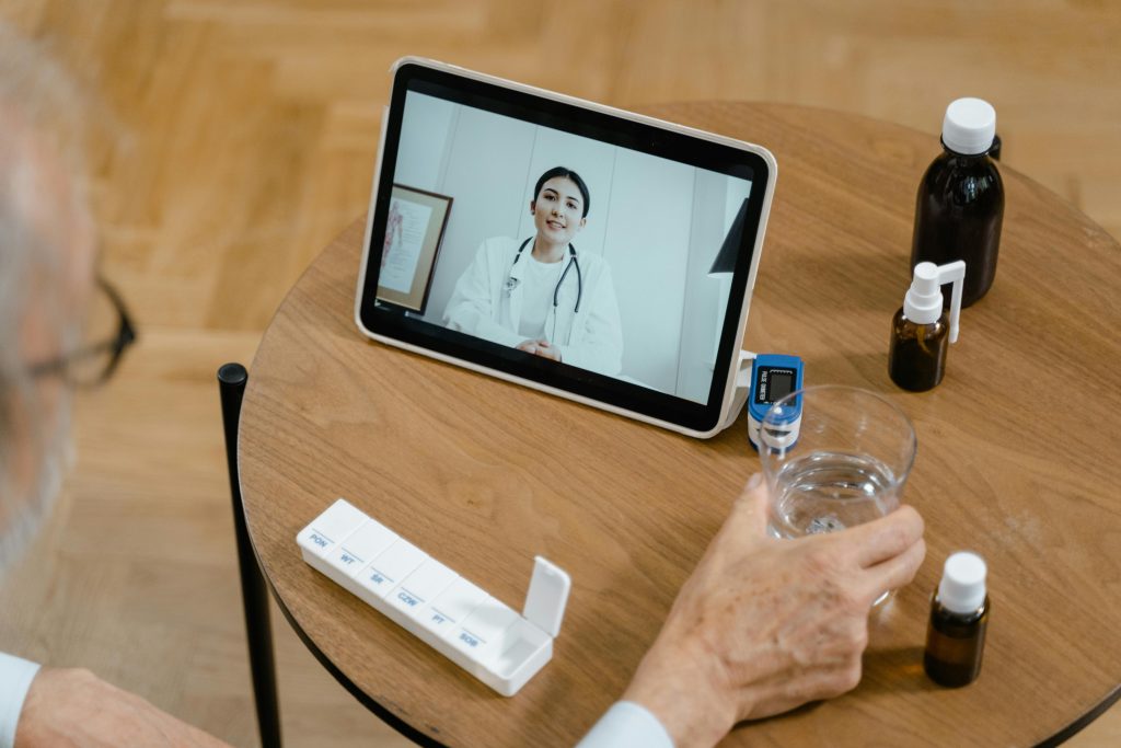 Patient talking to a doctor on a tablet