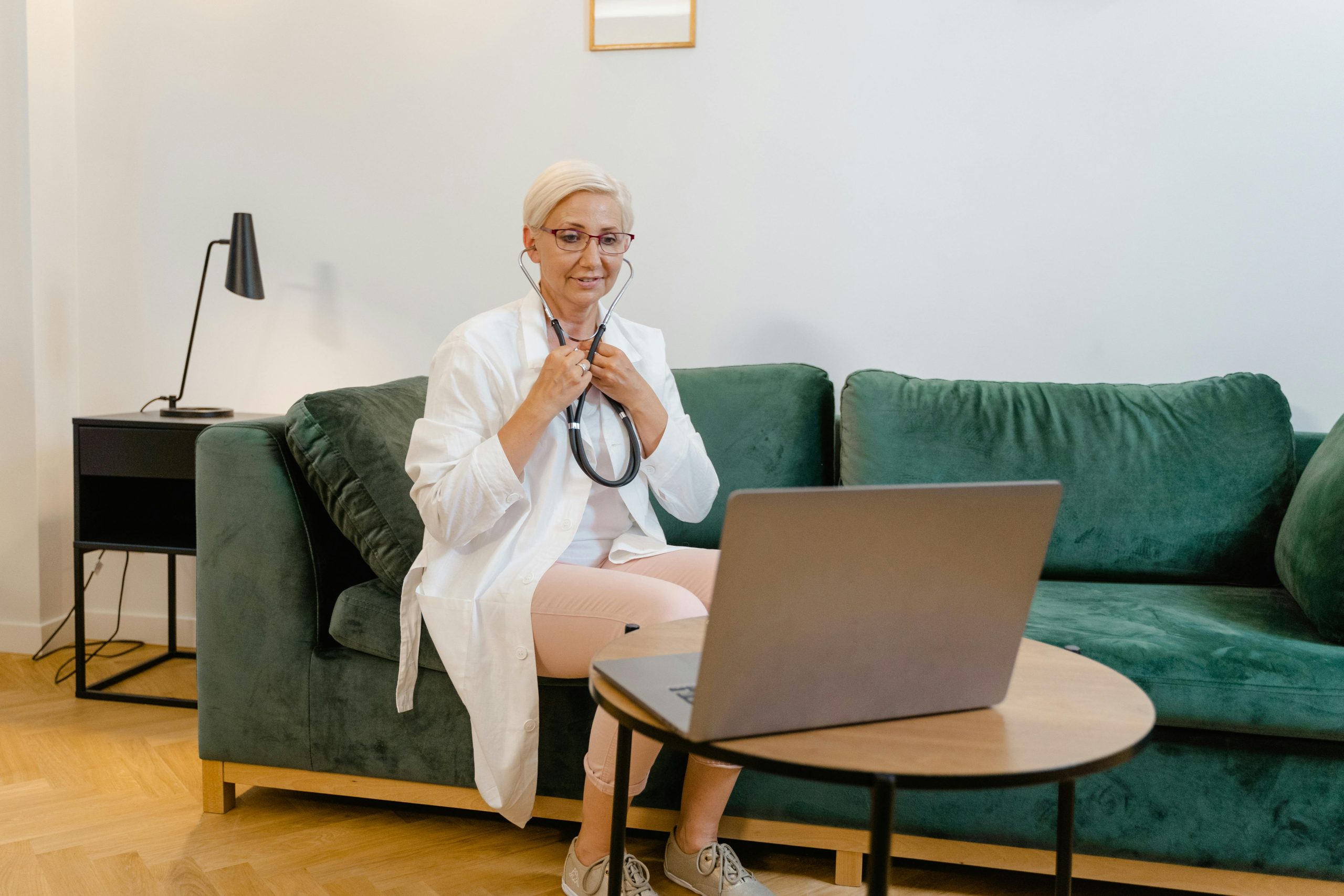 Doctor talking to patient on a computer