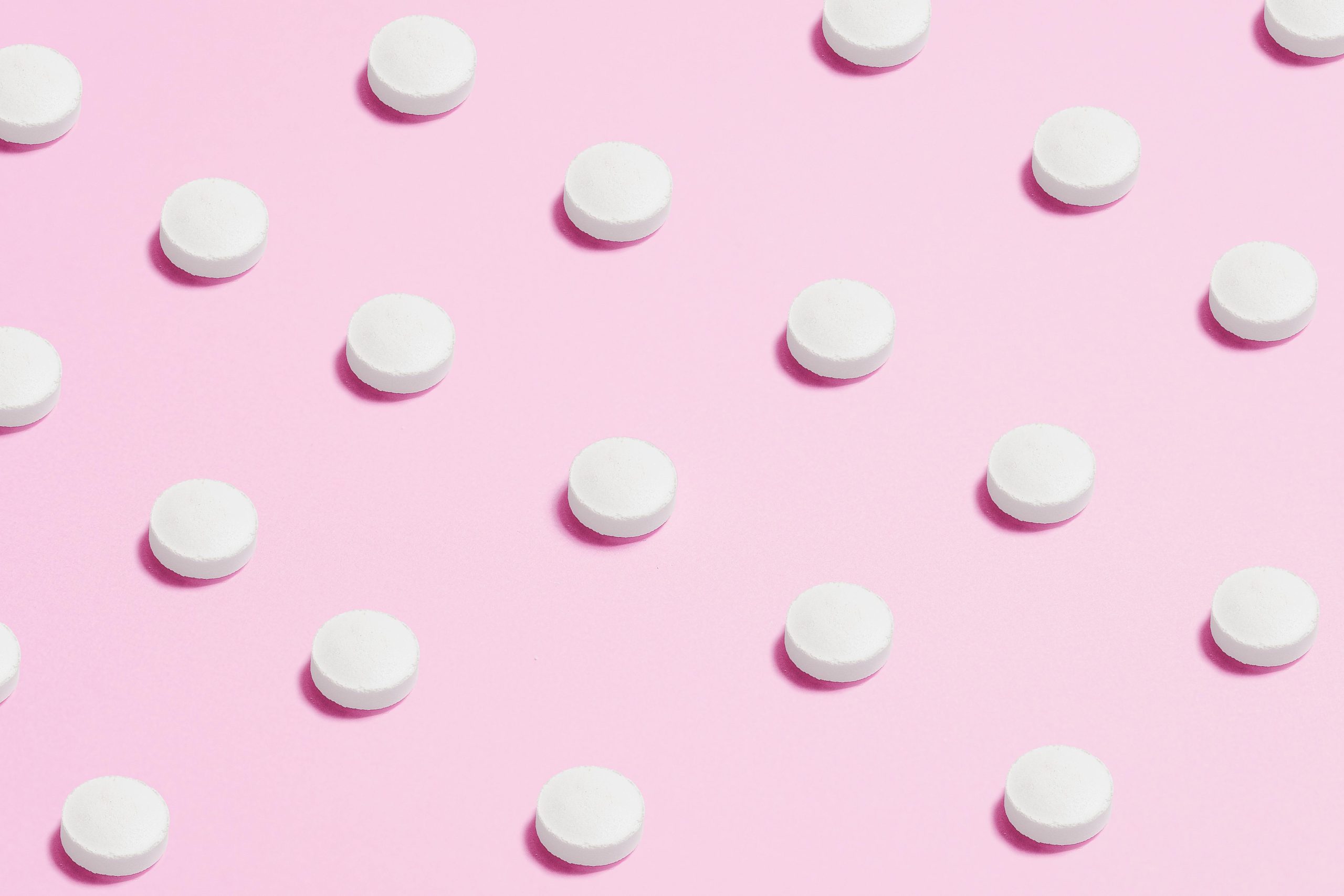 Medicine placed on a pink background