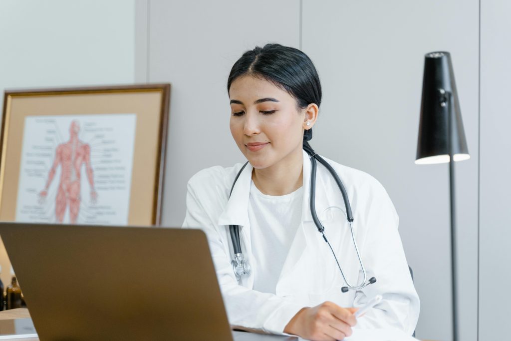 Doctor talking to patient on a laptop