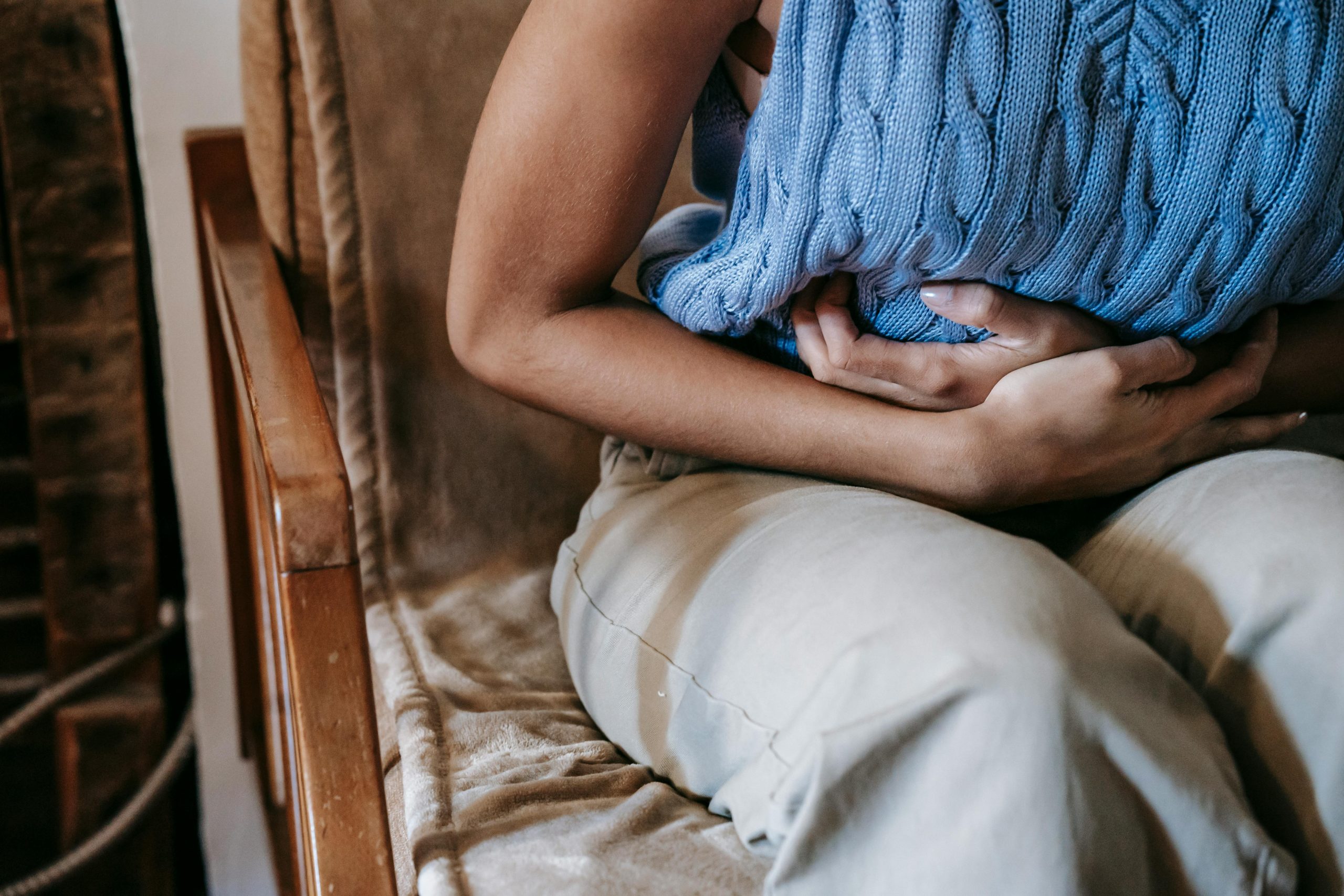 Person holding their stomach